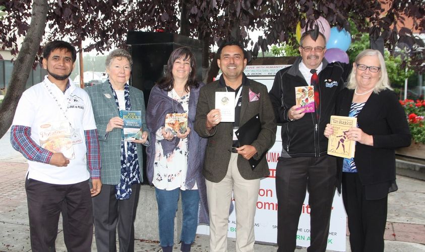 Syed Hassan with other volunteers at the Multicultural Library in Okotoks